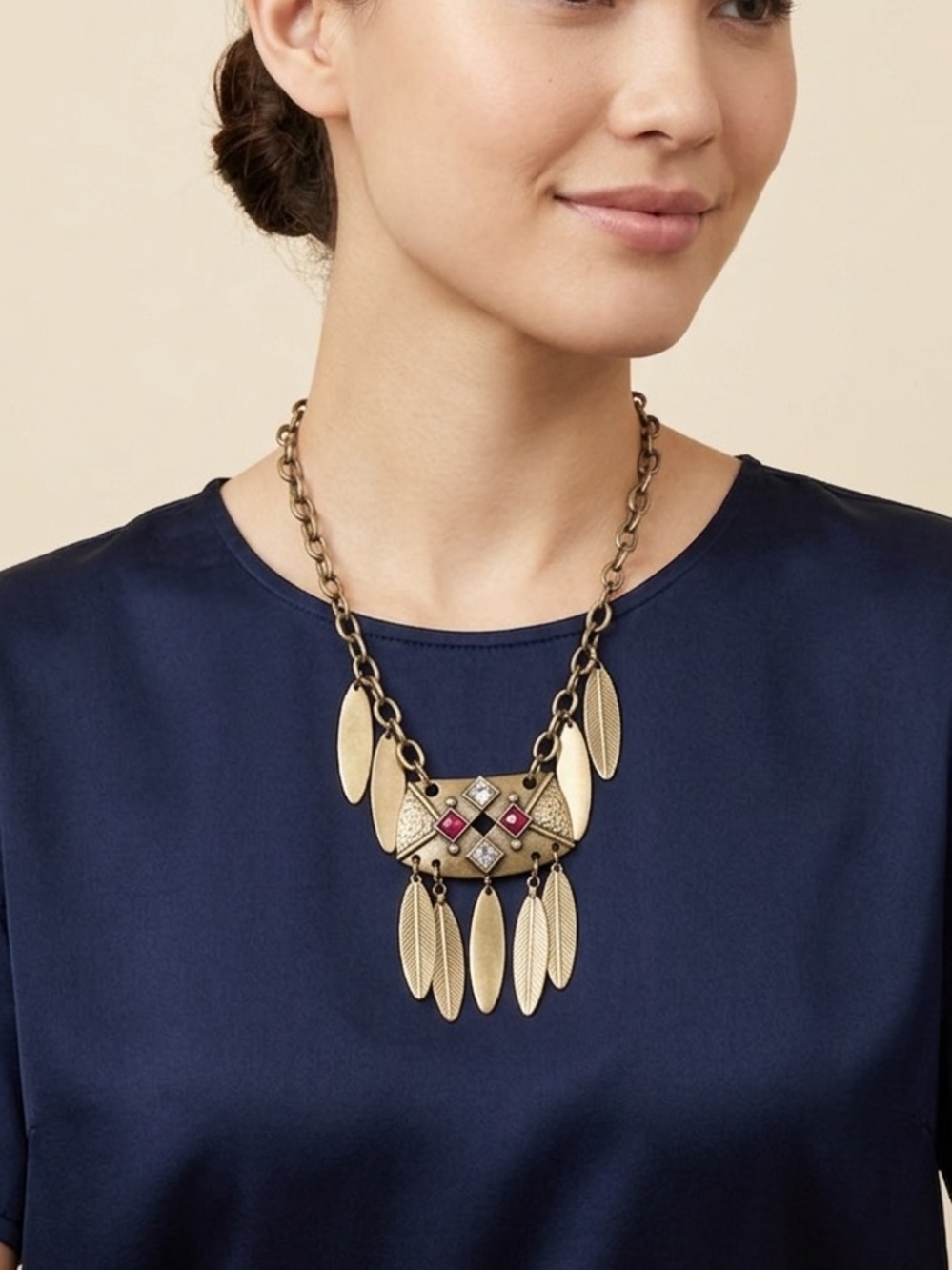 Gold Tone Geometric Pendant Necklace with red and clear rhinestones.